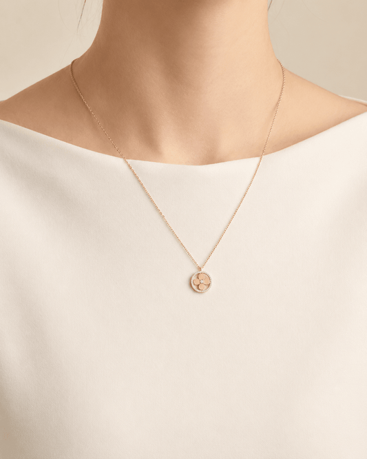 Jeweled clover pendant necklace worn on a fair-light skin model