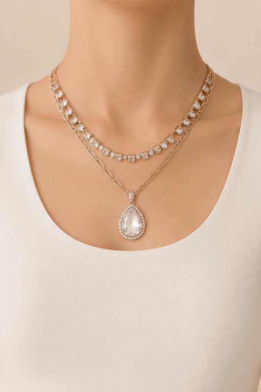 Clear jeweled teardrop layered necklace worn on a fair-light skin model