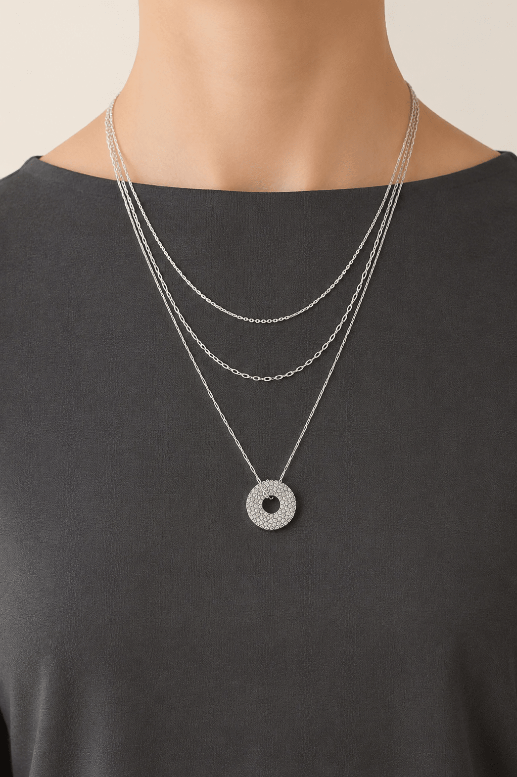 Jeweled circle layered necklace worn on a fair-light skin model
