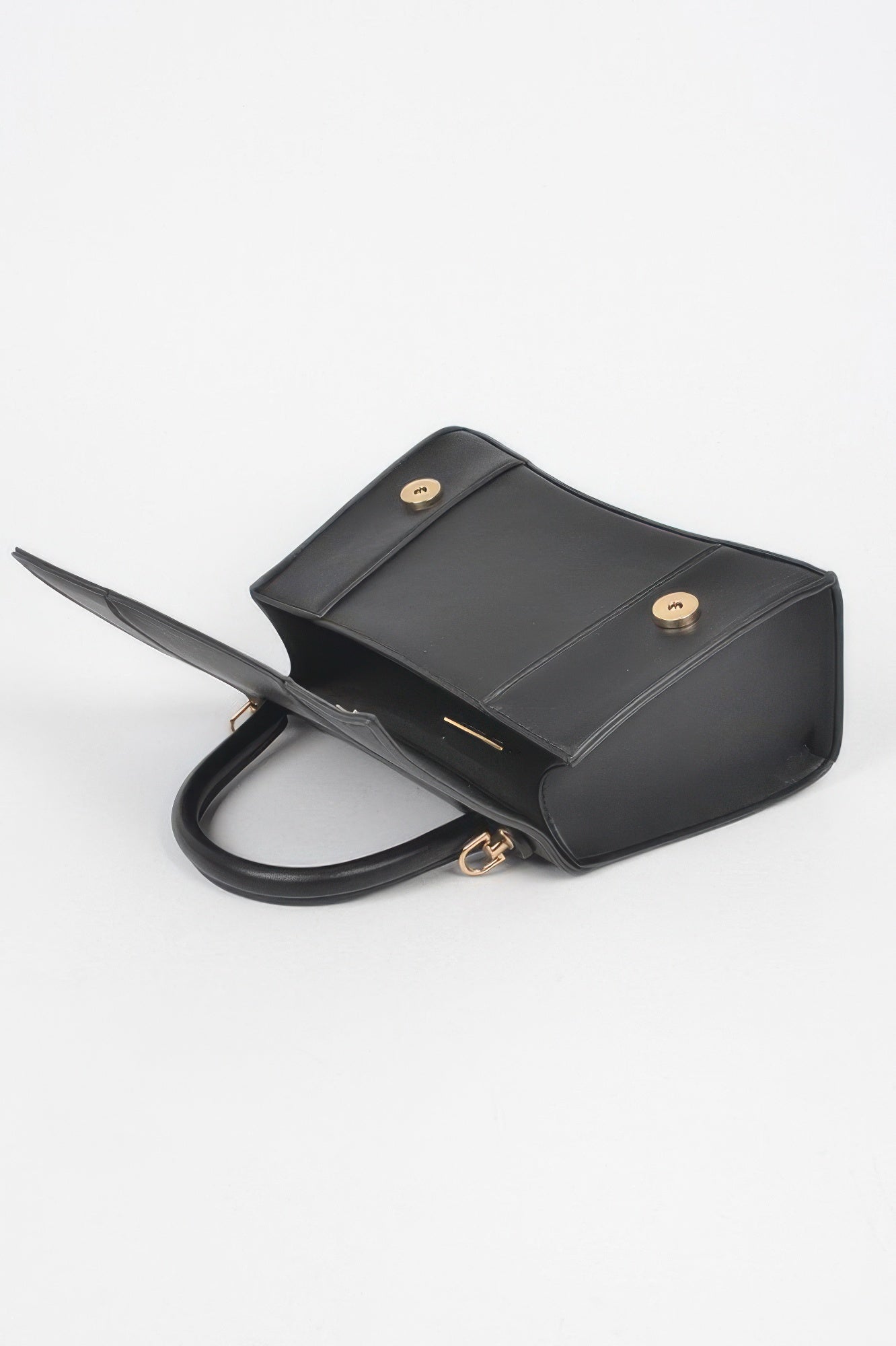 Structured top handle handbag detail view