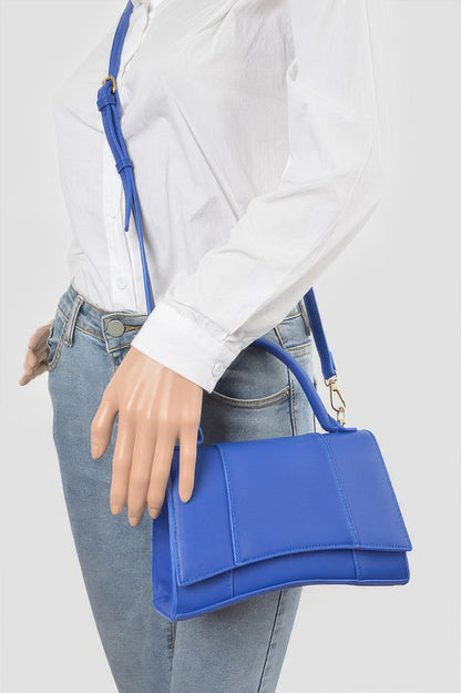 Structured top handle handbag detail view