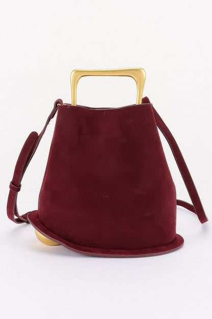Suede effect metal handle handbag detail view