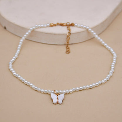 White Pearl Choker Necklace with Butterfly Pendant – Minimal Elegance | The Simple Co – Necklaces (Minimalist / Statement / Unis, minimalist style, quiet luxury aesthetic, modern essential – The Simple Co.